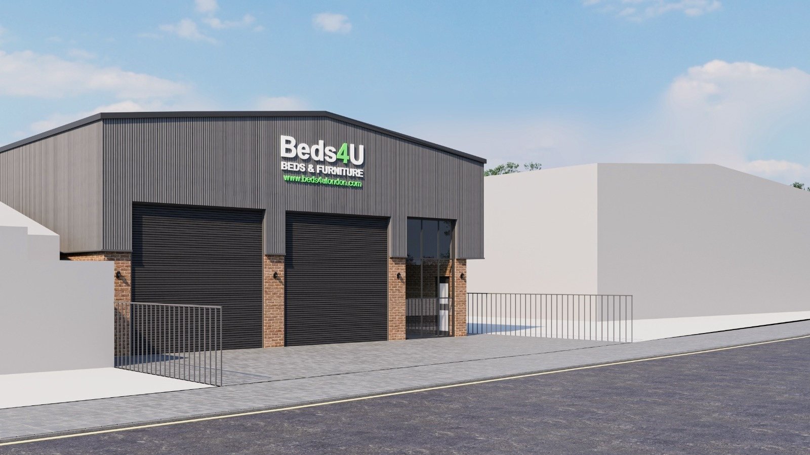 Front of the warehouse showing brick base, metal cladding and glazed entrance